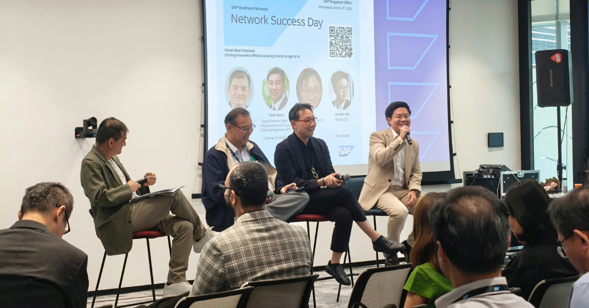 Procurement panel discussion with speakers seated on stage